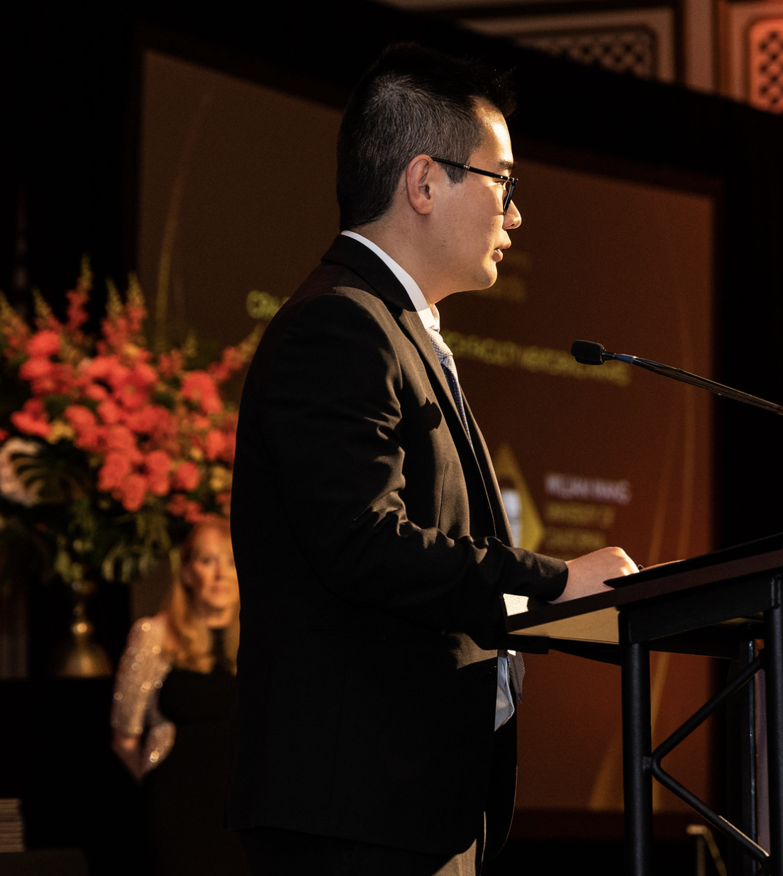 Dr. William Wang speaking at ACM Awards Banquet 2023
