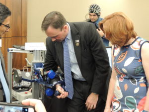 Rep. Pete Olson (R-TX) is shown the robotics demonstration by Marica O’Malley of Rice University.