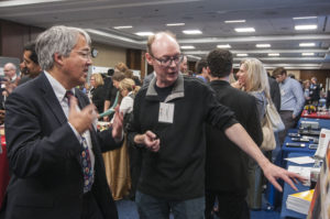 Laurent Itti, left, explains his research to Jim Kurose, Assistant Director of CISE at NSF.